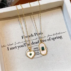 Elegant gold-plated heart and oval mother-of-pearl necklaces featuring green stones.