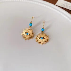 Unique vintage stainless steel sunburst evil eye hook earrings with blue turquoise beads