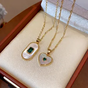Elegant gold plated mother-of-pearl necklace set featuring emerald green gemstones in box