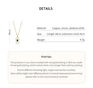 Detailed view of gold-plated abalone shell necklace with emerald green zircon