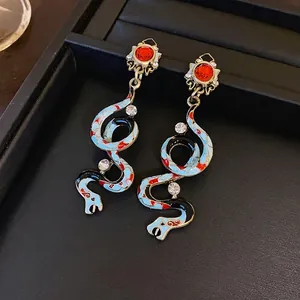Vintage gold-tone snake drop earrings with colorful enamel and sparkling rhinestones