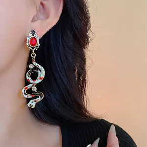 Vintage court style snake drop earrings with red gems, enamel details and silver needles
