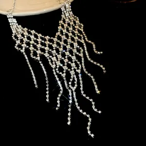 Detailed view of rhinestone geometric tassel necklace featuring a sparkling fringe design