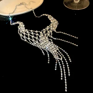 Detailed view of a glittering rhinestone geometric tassel necklace with long fringe