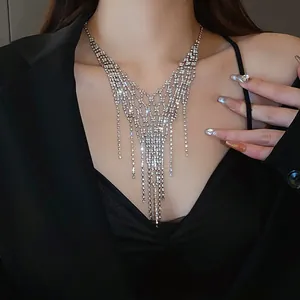 Detailed view of elegant sparkling rhinestone tassel necklace with a geometric mesh design