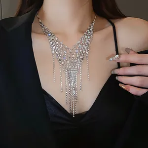 Close-up of elegant rhinestone tassel necklace with multi-layer geometric chain design