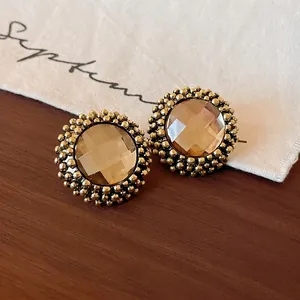 Vintage palace style round stud earrings with faceted amber stone and golden beads