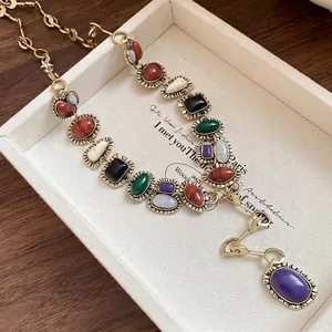 Elegant vintage gold-tone chain necklace featuring colorful geometric resin stones in tray