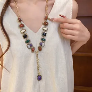Vintage colorful resin geometric gemstone long necklace displayed on a female model