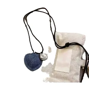 Stylish heart pendant necklace with denim fabric and silver metallic charms for women