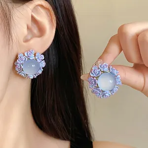 Elegant purple rose floral resin stud earrings with pale blue center stone