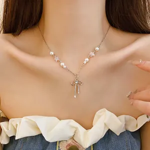 Close-up of a sweet Korean style silver choker featuring bow pendant and star-shaped pearls