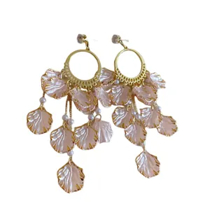 Elegant pink petal dangle earrings with gold hoops and sparkling zirconia accents.