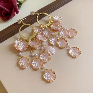 Elegant pink petal dangle earrings with golden hoops and zircon accents
