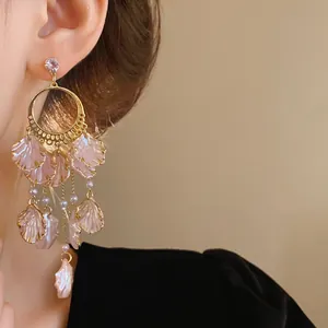Detailed macro view showing the delicate pink petals and sparkling zircon of these dangle earrings