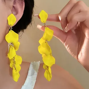 Dramatic yellow layered flower petal tassel earrings for a trendy statement look