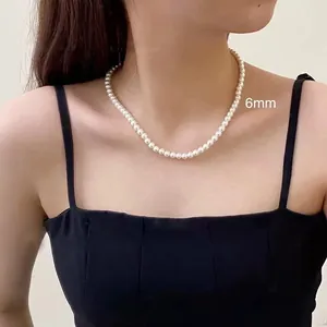 Elegant 6mm white pearl strand necklace displayed on a model for variant selection