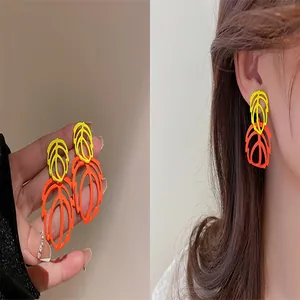 Stylish double-layer hollow leaf earrings in vibrant yellow and orange tones