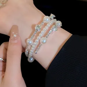 Elegant French style multi-layer pearl bracelet featuring sparkling diamond accents for women