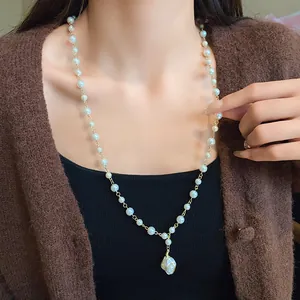 Elegant French style irregular pearl long necklace with baroque pearl pendant shown on a model