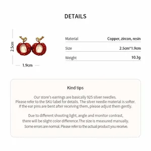 Detail shot showing the dimensions and materials of the red lychee earrings.