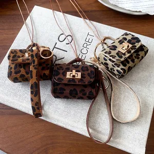 Leopard print micro bag pendant necklace for women with detachable chain and gold hardware.