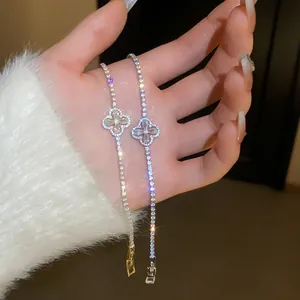 Elegant gold and silver clover bracelets with sparkling zirconia detail for women.