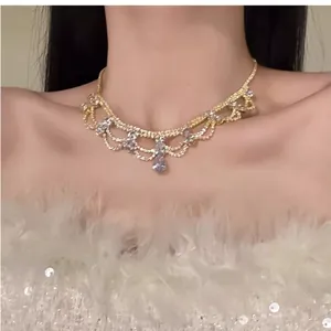 Detailed view of a vintage palace style necklace with rhinestones and water-drop pendant