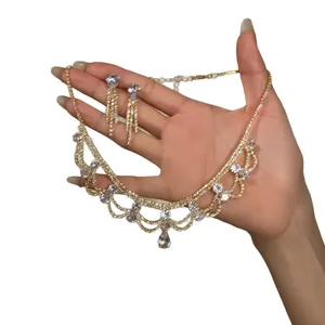 Vintage court style rhinestone necklace and earrings set with teardrop crystals.