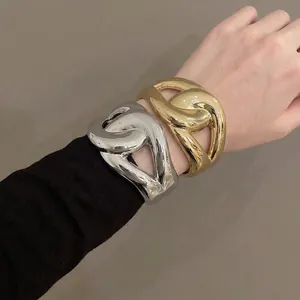 Chunky twisted acrylic cuff bracelet with metallic gold and silver finish for women