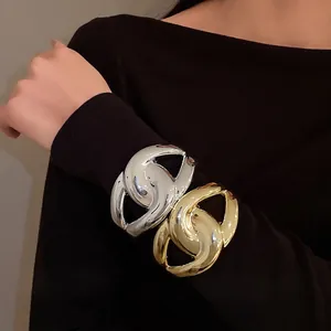 Oversized wide surface cross acrylic open bangle in metallic gold and silver finish