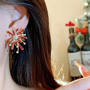 Eleganti orecchini a perno a forma di fuochi d'artificio con smalto rosso e zirconi