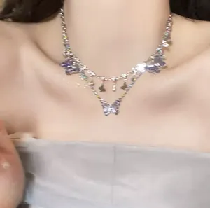 Detailed view of an elegant butterfly choker necklace with purple stones and rhinestones