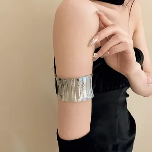 Silver wide metal arm cuff bracelet shown on upper arm for chic fashion styling