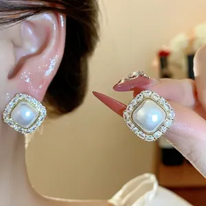 French style square pearl stud earrings with a sparkling cubic zircon gemstone halo