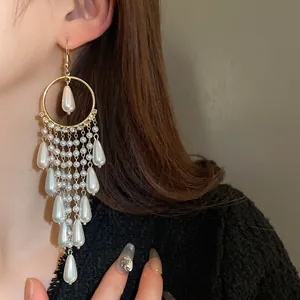 Detailed close-up showing the luster of vintage pearl and zircon long tassel earrings