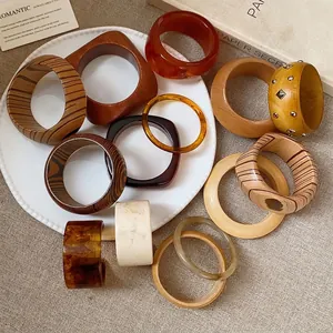 Artistic wood grain and amber resin bangle set with vintage minimalist aesthetic