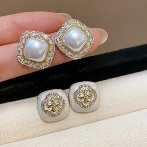Detailed view of elegant French style square pearl and zircon flower stud earrings for women
