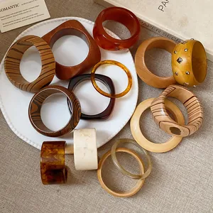 Detailed view of vintage wood grain and resin acetate bangles with unique textures