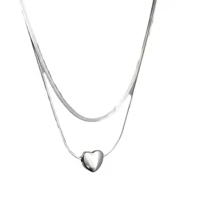 Minimalist silver double-layer necklace with puffy heart pendant and flat snake chain