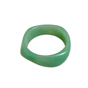 Minimalist green resin square spiral bangle with marbled effect for women.