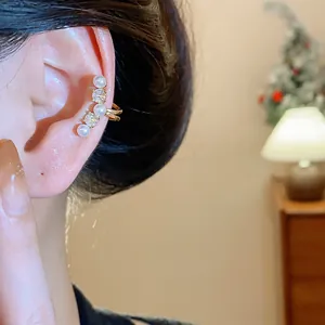 Elegant pearl and zircon ear cuff for non-pierced ears, delicate jewelry detail