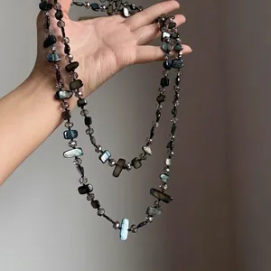 Bohemian long necklace with iridescent shell beads and faceted grey crystals for women