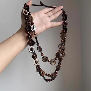 Bohemian multi-layer brown beaded necklace with coconut shell discs for beach vacation