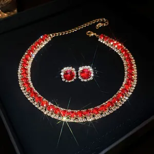 Elegant vintage jewelry set featuring red gemstones and sparkling crystal accents