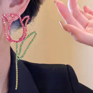 Elegant tulip-shaped earrings featuring sparkling pink and green rhinestones.