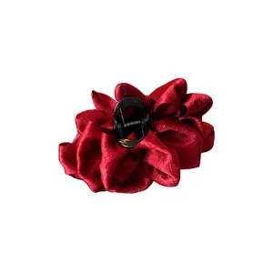 Elegant red pleated fabric flower hair claw clip with a luxurious multi-layer satin texture