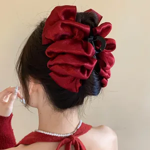Elegant deep red multi-layered pleated satin fabric hair claw clip for chic bun styles