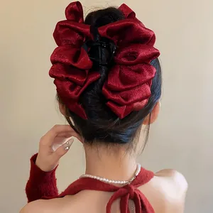 Elegant oversized dark red ruffled fabric bow hair claw clip for bun hairstyles