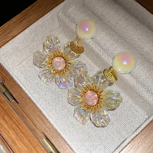 Elegant vintage resin flower drop earrings with iridescent finish and pink crystals